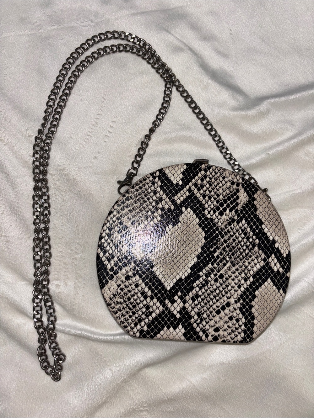 Snake-Print Round Crossbody Bag in Black and Cream